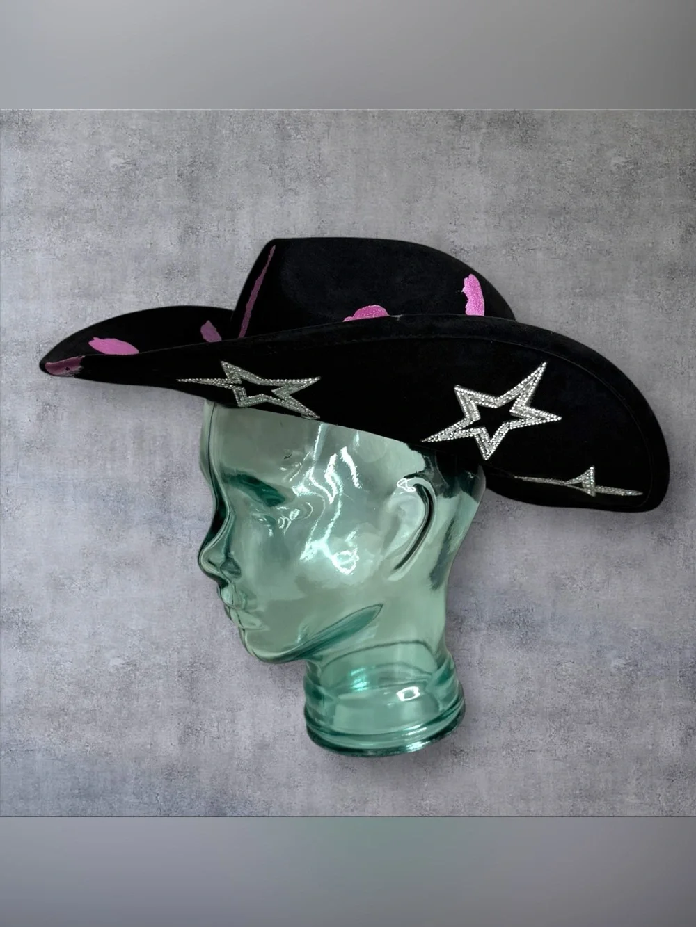 Black Cowboy Hat with Pink Accents and Star Embellishments